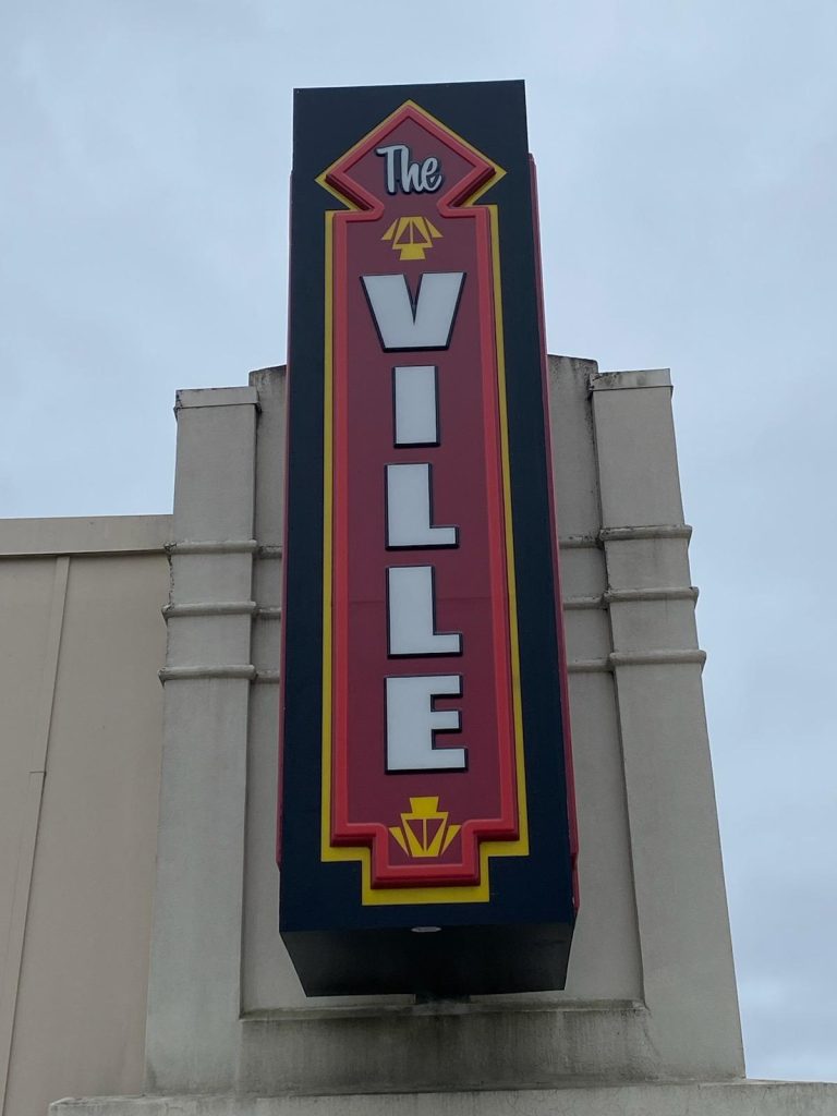The Ville Triple-Sided Flag Mounted Sign