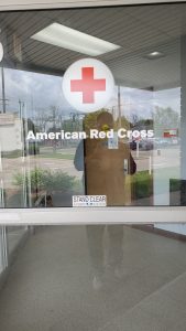 American Red Cross graphic in white lettering on glass sliding door
