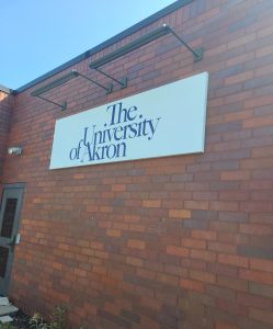The University of Akron non illuminated white wall sign