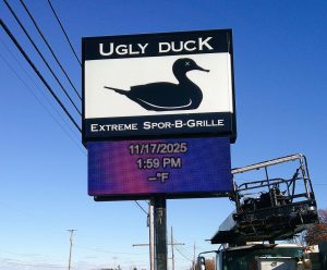 Electronic message center added beneath existing pole signage for Ugly Duck in Wooster, Ohio.