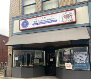 Adams Signs & Graphics created a box sign for The Tax Professionals Inc.