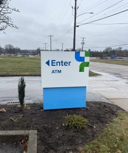Enter to ATM directional sign installed by Adams Signs & Graphics at DoverPhila Credit Union in Dover, Ohio.