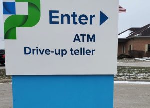 Dover Phila in Newcomerstown, Ohio, had Adams Signs & Graphics install flat routed aluminum directional signs with printed graphics to guide customers