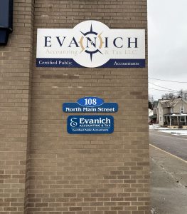 Custom cut‑to‑shape aluminum composite wall signs with vinyl lettering, produced and installed by Adam Signs for Evanich Accounting & Tax LLC in Minerva, Ohio.