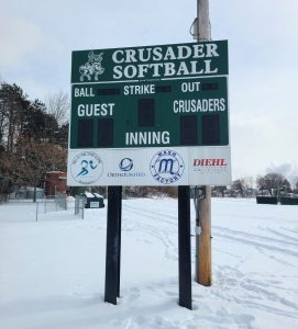 Overlay panels installed on scoreboard at Central Catholic High School by Adams Signs & Graphics in Canton, Ohio.