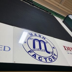 Installed overlay panels on indoornscoreboard at Central Catholic High School by Adams Signs & Graphics in Canton, Ohio.
