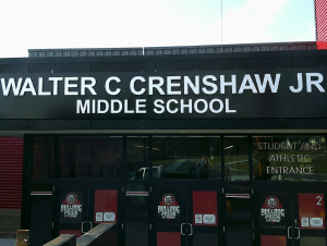 Dimensional letter sign reading Walter C Crenshaw Jr Middle School mounted above the student and athletic entrance with Bulldog Pride Citywide door graphics | Adams Signs & Graphics