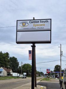 Pole sign for Canton South Eyecare with an eye logo and blank changeable copy panel, installed roadside near a busy Canton, Ohio intersection | Adams Signs & Graphics